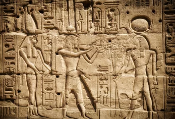 Rolgordijnen Art of ancient Egypt. Bas-relief on the wall of the ancient temple of Karnak in Luxor © KAL'VAN