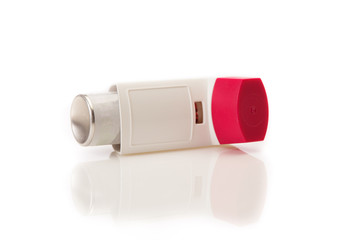 inhaler on a mirrored surface, isolated on a white background