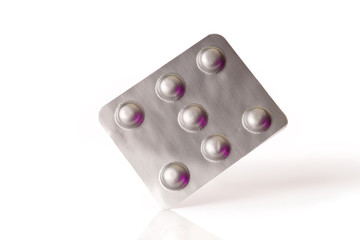 a silver blister with pills isolated on a white background