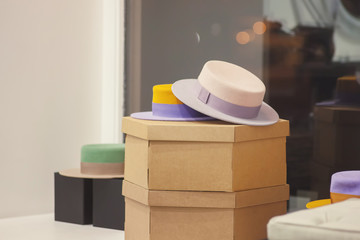 Hats on sale in accessories store. Clothing shop-window.