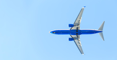 modern airplane at takeoff seen from the bottom with place for copy-paste
