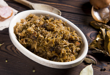 Cabbage stew with meat, mushrooms and dried plums - traditional polish dish