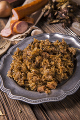 Cabbage stew with meat, mushrooms and dried plums - traditional polish dish