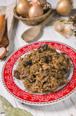 Cabbage stew with meat, mushrooms and dried plums - traditional polish dish