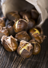 Chestnuts on wooden background