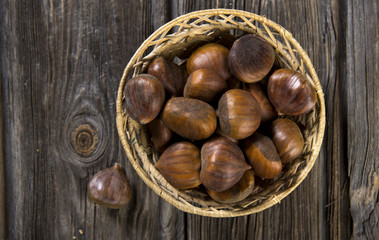 Chestnuts on wooden background