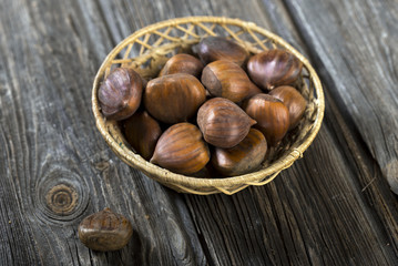 Chestnuts on wooden background