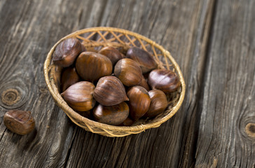 Chestnuts on wooden background