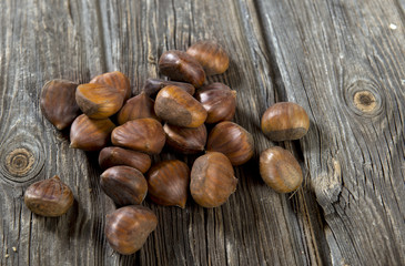 Chestnuts on wooden background