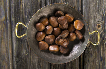 Chestnuts on wooden background