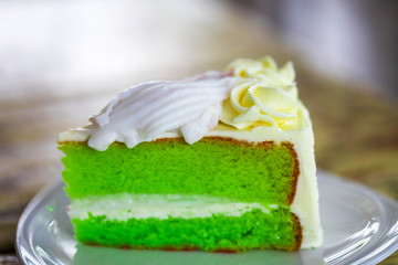 chiffon pandan fresh coconut butter cake on wooden table