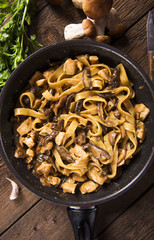 Tagiatelle pasta with creamy sauce with porcini mushrooms