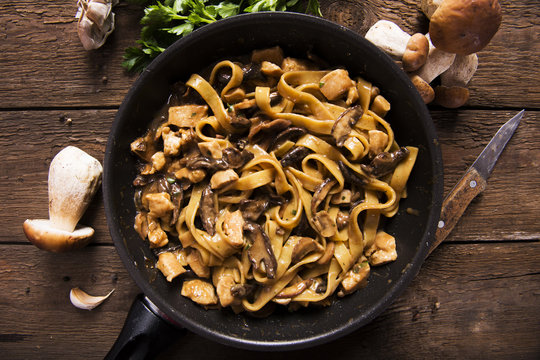 Tagiatelle pasta with creamy sauce with porcini mushrooms