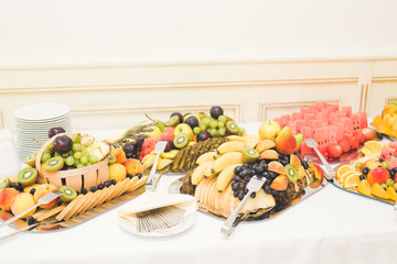 Various sweet sliced fruit on a buffet table