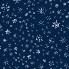 Christmas seamless pattern from snowflakes. New year festive texture for design postcards, invitations, greetings, and clothing.
