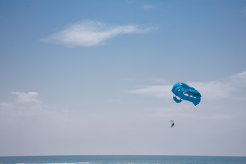 man with the blue parachute