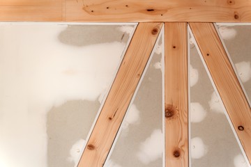 Gypsum plasterboard on the woodwind wall. Construction of a family house.