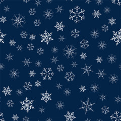 Christmas seamless pattern from snowflakes. New year festive texture for design postcards, invitations, greetings, and clothing.