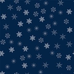 Christmas seamless pattern from snowflakes. New year festive texture for design postcards, invitations, greetings, and clothing.