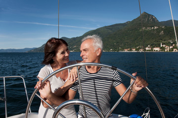 Older couple sailing together