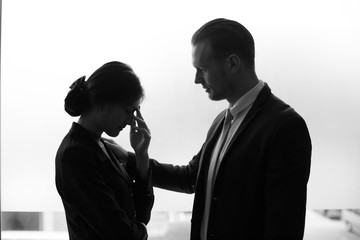 Desperate young Asian businesswoman unable to work with stress situation, black and white tone.