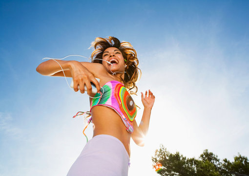 Energetic Woman Dances To MP3 Player