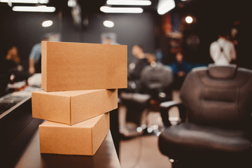 Barbershop. Pile of boxes with gifts, in the background a barber chair. Place for your text. copyspace