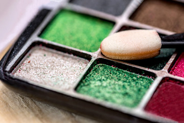 paint for a make-up on a wooden table
