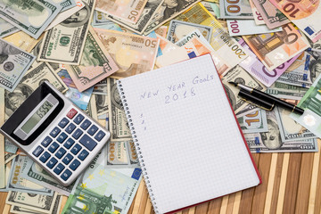 newyear goals for 2018 with dollar and euro banknotes