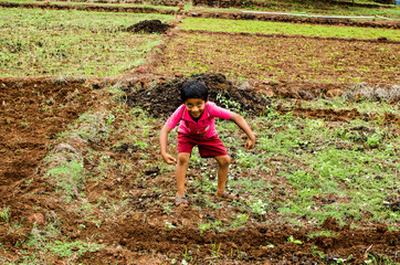Village kid playing in farm