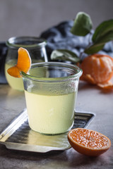 Cold mandarin and lemon cocktail with vodka and сointreau in jar