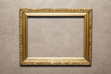Blank decorated picture frame on concrete wall