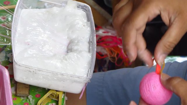 Woman Spinning Sepak Takraw Balls