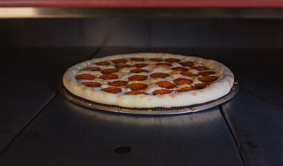 pizza baking in the oven