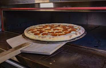 Pizza take out from the oven