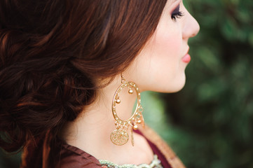 Woman Hands with black mehndi tattoo. Hands of Indian bride girl with black henna tattoos. Fashion. India