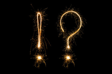 sparklers forming a question and exclamation mark