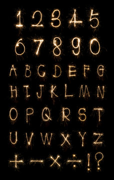 Alphabet And Numbers Sparklers On Black Background