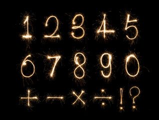 Alphabet and Numbers sparklers on black background