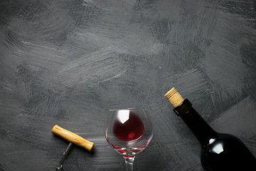 Red wine bottle on a wooden background