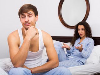 Couple sorting out relationships in bed