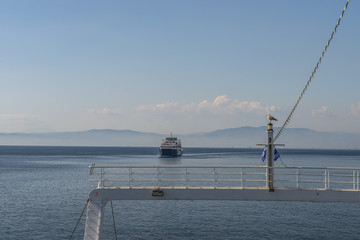 Ferry boat in the sea, back view