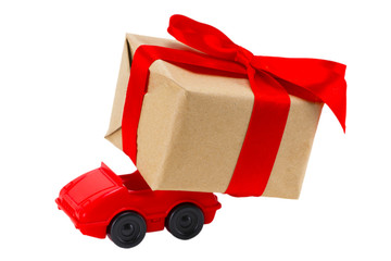  Red toy car delivering gifts box on a white background