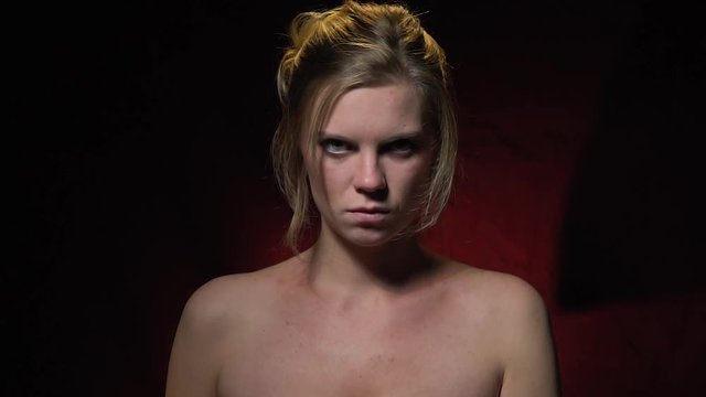 Wicked woman shows fuck you, female aggression. Irrelevant gestures