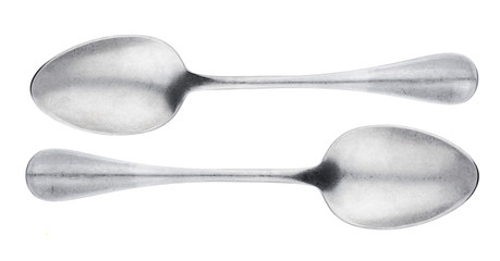 Metal spoon isolated on white background, top view