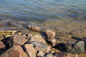 Sea waves splashing over rocks