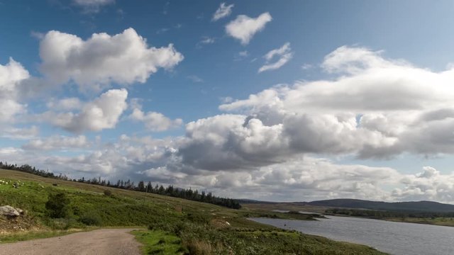 hyperlapse POV shot from a camera attached to the front of a vehicle driving through beautiful empty roads in the scottish highlands