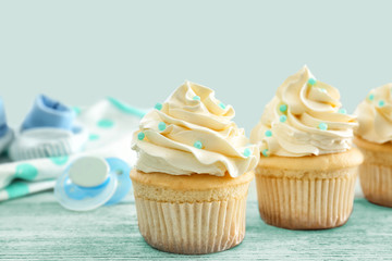 Tasty cupcakes for baby shower party on table