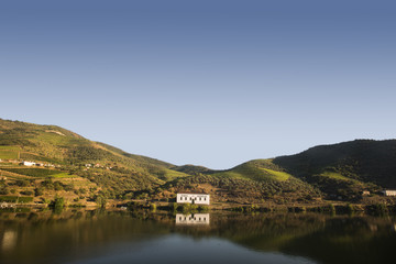 Fototapeta na wymiar a house reflecting on the douro river, portugal