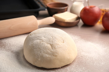 Raw puff pastry on table